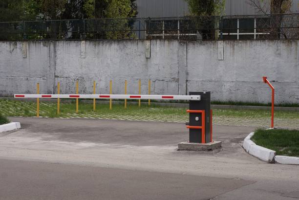 istock one closed white red automatic barrier on the street 1404542969