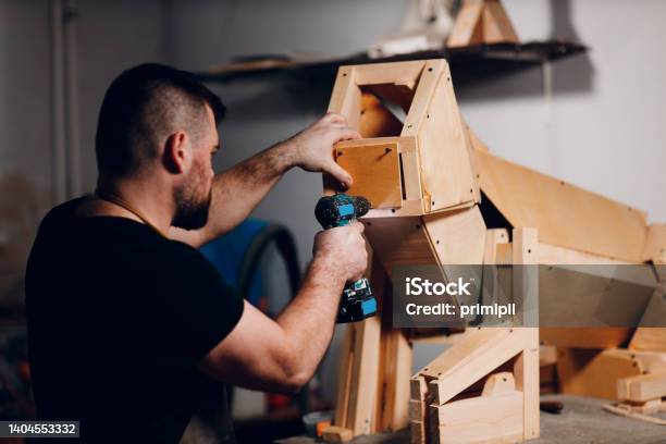 Artisan Craftsman Carpenter Sculptor Frame Wooden Create Carcass Framework Stock Photo - Download Image Now