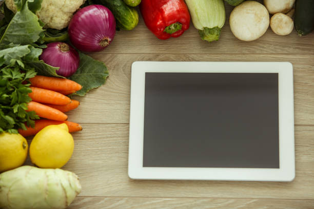 istock Find new recipes with organic vegetables in your digital tablet 1404553551