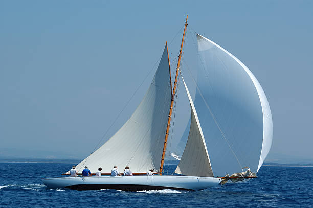 Magnificent white luxury sailboat with gennaker