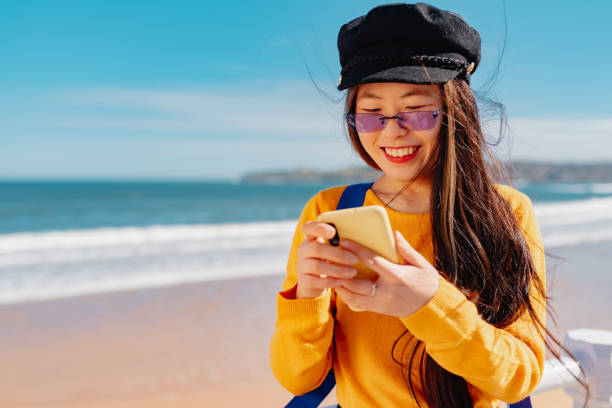 istock woman with smart phone 1404558170