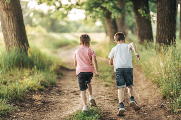 istock Kids running in nature 1404559891