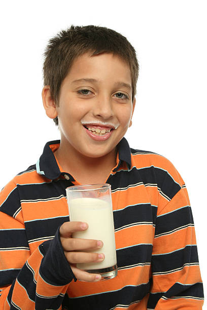 istock Boy drinking a glass of milk 140456216