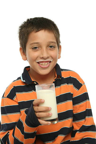 istock Boy drinking a glass of milk 140456301