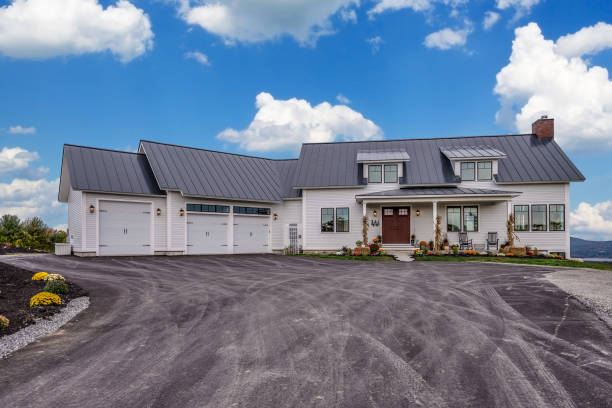 istock Asphalt driveway and three car garage 1404563510