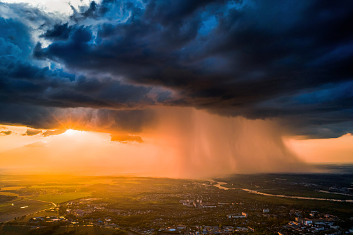 Dark dramatic sky aerial view. Sunset. Scary cloud. Drone photography. Flying above earth. Dangerous heaven. Storm weather. Summer rain. Nature background. Rainy season. Atmospheric mystical landscape