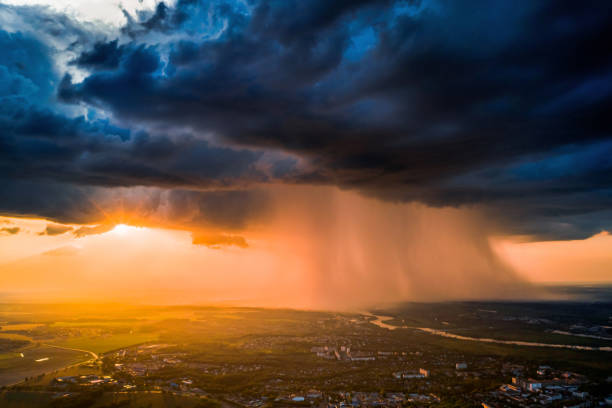 Dark dramatic sky aerial view. Sunset. Scary cloud. Drone photography. Flying above earth. Dangerous heaven. Storm weather. Summer rain. Nature background. Rainy season. Atmospheric mystical landscape stock photo