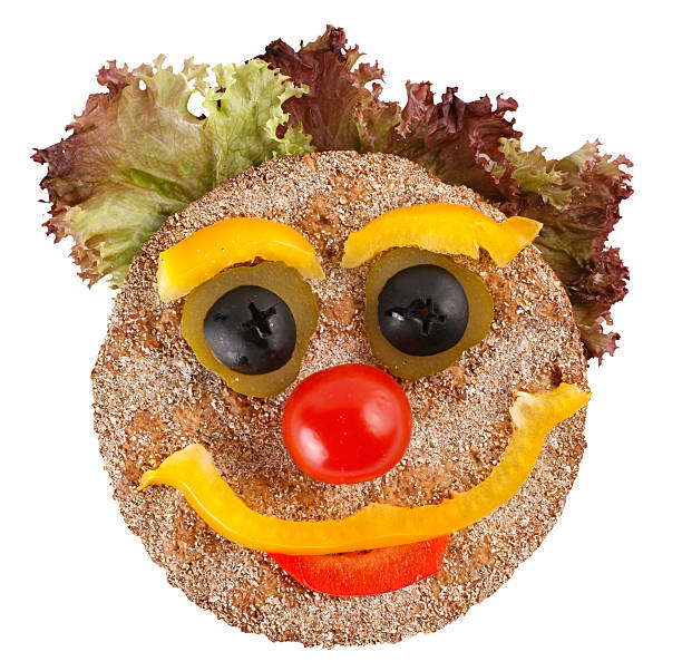 Happy face made of vegetables and bread stock photo