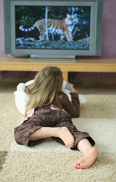 istock Little girl watching tv 140456843