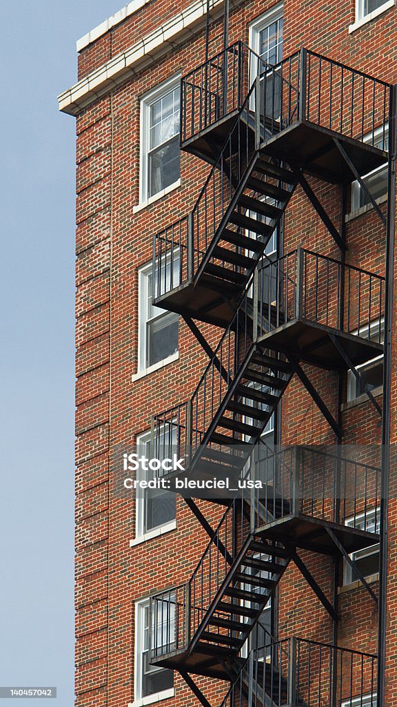 Fire Escape Stairs Fire Escape Stairs against a red brick building Built Structure Stock Photo