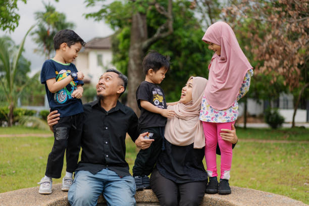 Malaysian Muslim Family Having Fun Portrait at Playgroud stock photo