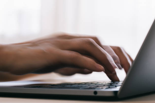 istock Close-up image of hand input to laptop 1404573410