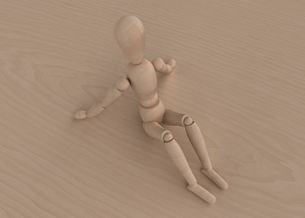 Mannequin sitting on wood