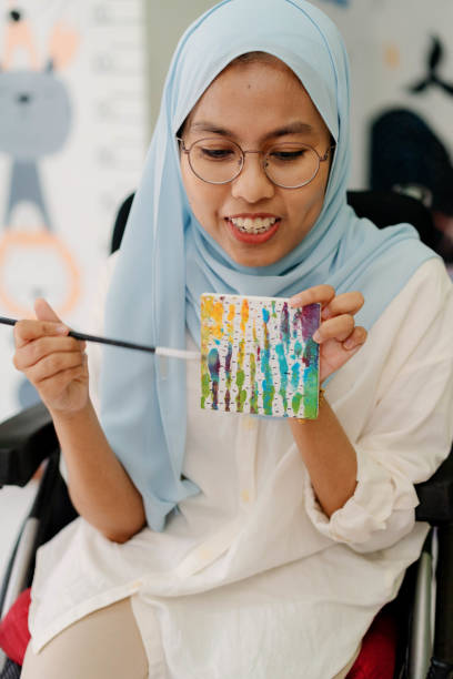 istock Muslim Female Art Teacher Explaining Her Artwork Painting 1404574609