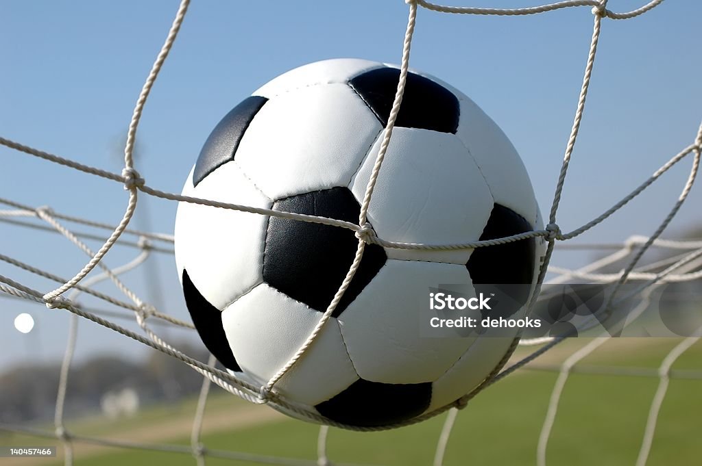 Soccer Ball in Net Soccer ball in goal.  Achievement Stock Photo
