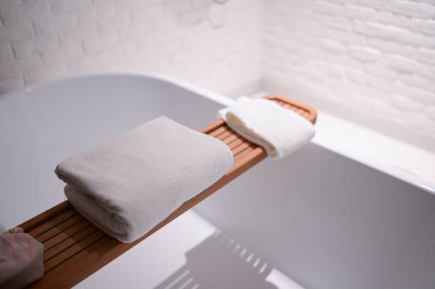 istock white towels put on bathtub in the bathroom 1404579502
