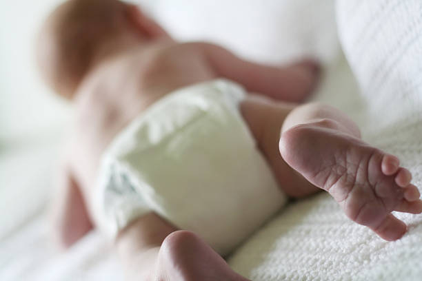 istock Blurred back of baby with focus on foot 140458296
