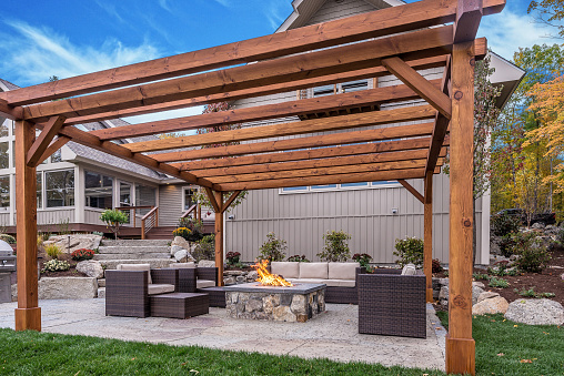 Hot tub, fire pit and patio furniture in a perfect setting for entertaining