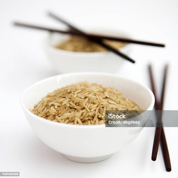 Brown Rice Stock Photo - Download Image Now - Bowl, Brown, Chopsticks