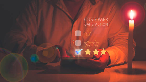 istock Customer Service Satisfaction Survey Concept. Businessman  satisfaction through tablet screen application by rating the highest satisfaction and giving 3 stars.man touching on tablet 1404589054