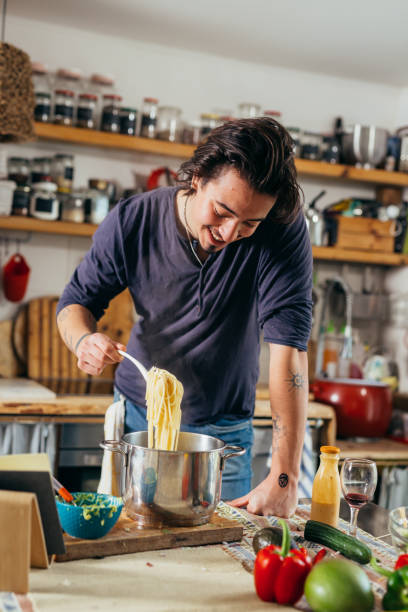 istock man preparing food in his home kitchen 1404591713