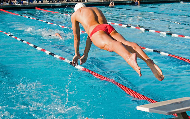 istock An image of a male swimmer jumping into the pool 140459196