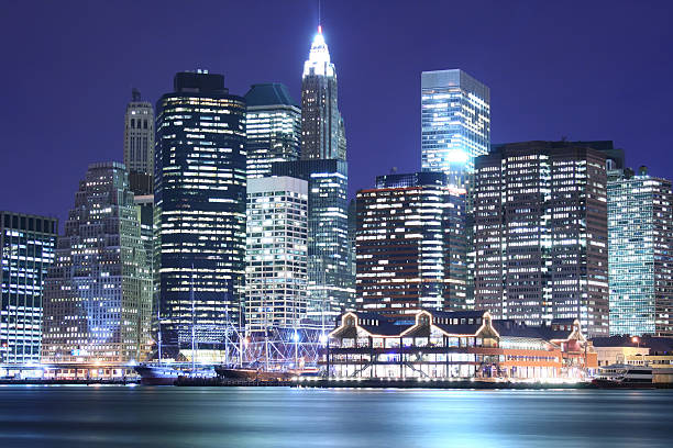 istock Illuminated image of low Manhattan skyline at night 140459270