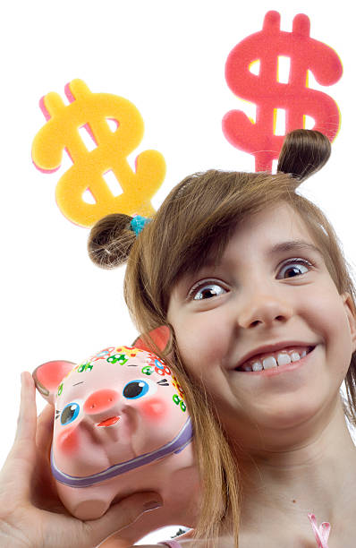 Smiling young business woman thinks of accumulation dollars stock photo