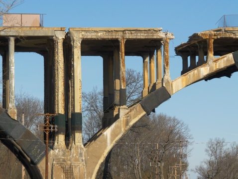 Close-up of bridge slated for demolition, explosive pads wrapped on arches