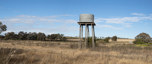 A pumpjack (oil derrick) and oil refinery in Seminole, West Texas.