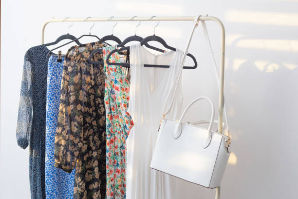 istock summer dresses on hangers on white background 1404603452