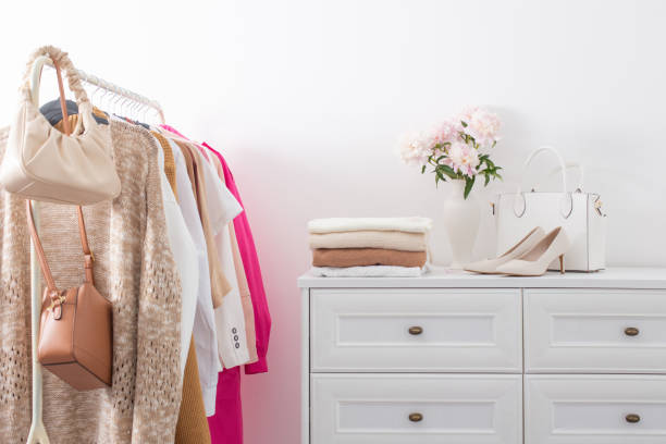 istock female clothes on hangers  in  white room 1404603467
