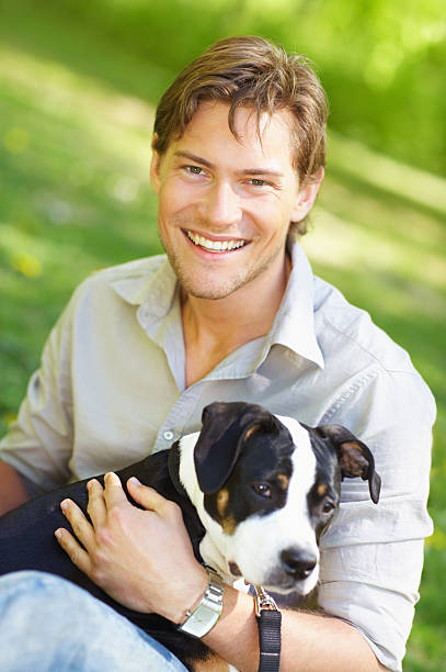 istock Close-up of a young man with his dog 140460564