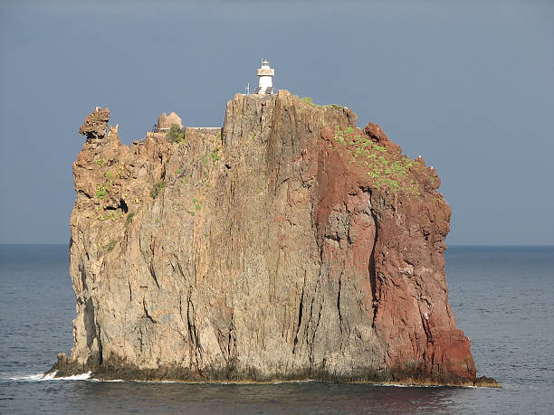 lighthouse on the rock stock photo