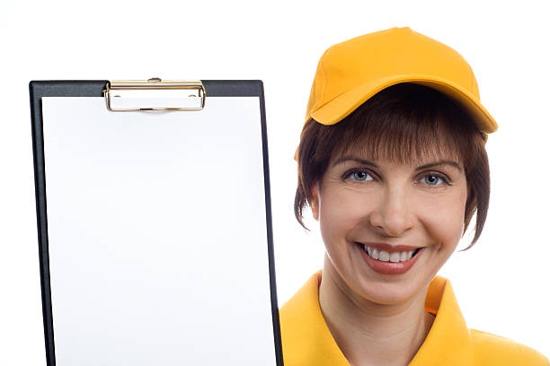 Young woman shows the blank page on Clipboard stock photo