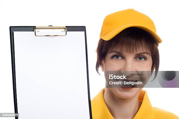 Young Woman Shows The Blank Page On Clipboard Stock Photo - Download Image Now - Adult, Adults Only, Baseball Cap