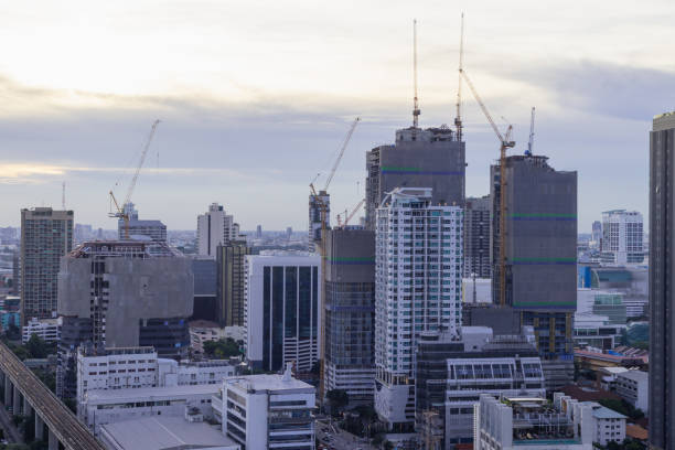 istock Downtown distric ciyscape and construction site building on sunset sky background 1404607254