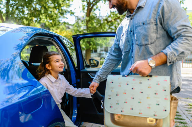 istock Father taking his daughter to school 1404608367