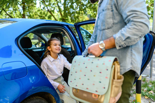 istock Father taking his daughter to school 1404608714