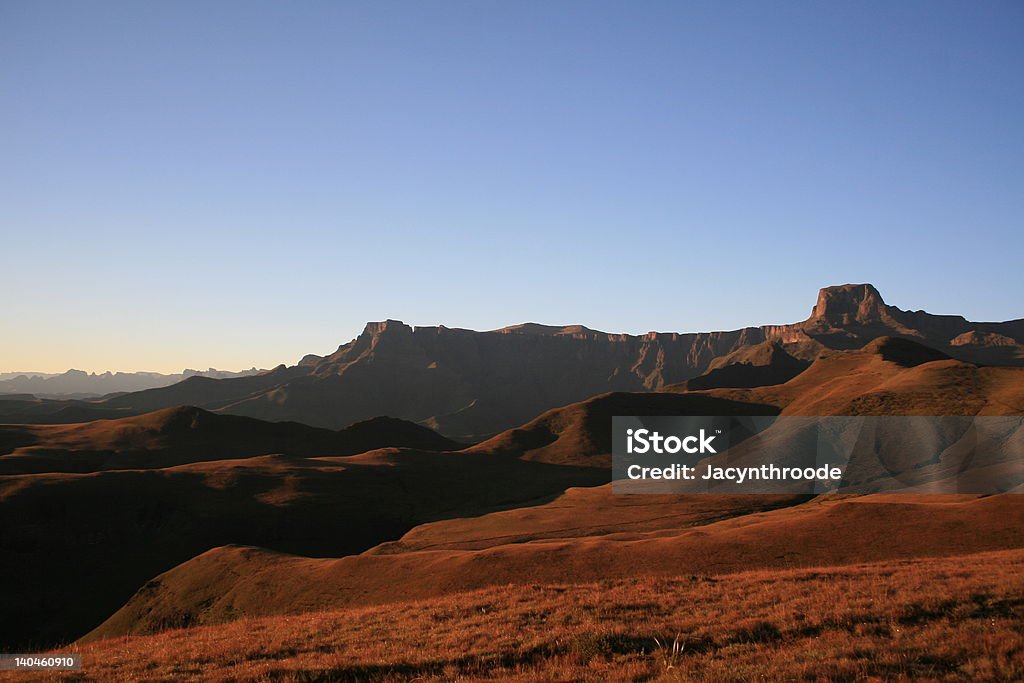 The Amphitheatre The magnificent foot hills of ""The Amphitheatre"" one of the more dominating ranges in the world heritage site of the Drakensberg. South Africa Amphitheater Stock Photo