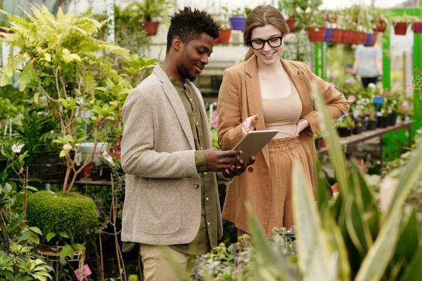 istock People choosing plants for new house design 1404610302