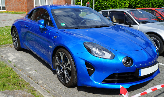 Papenburg, Germany - June 17 2022 Renault Alpine club meeting day. On the corner stands a blue Alpine A110 (version 2017)