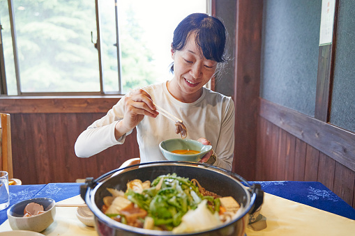 Sukiyaki is a Japanese dish in which meat and other ingredients are grilled or stewed in a shallow iron pot. Seasonings include soy sauce, sugar, and sake, and a pre-made combination of these ingredients is used.
