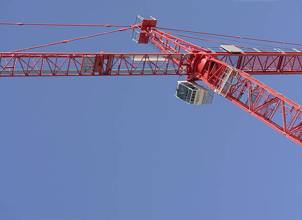 Construction crane against blue sky (detail) stock photo