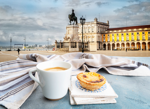 cafe with pasteles de nata and view of famous Lisbon Commerce Square, Portugal