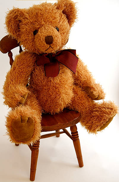 Teddy  Sitting on a Chair stock photo