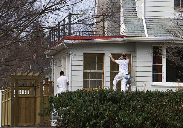 Time to paint 1 Painters preparing a house to be painted                    house painter ladder paint men stock pictures, royalty-free photos & images
