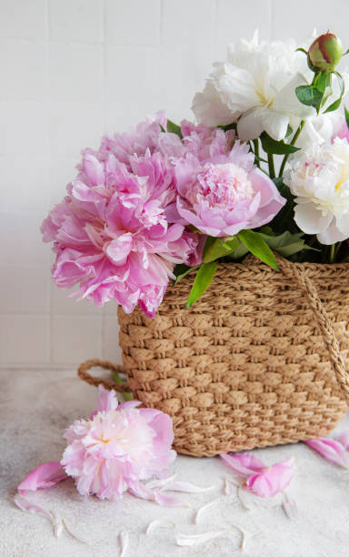 istock Wicker bag with peony flowers 1404618492