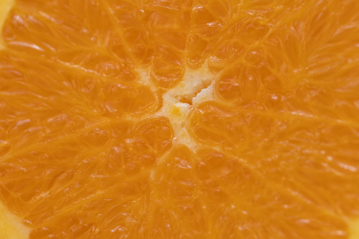 Extreme close up shot of a sliced orange.