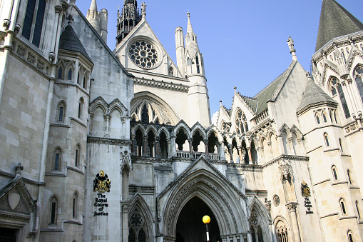 Entrance and front view of the Royal Courts of Justice in the City of London.  Note the coat of arms on your left.